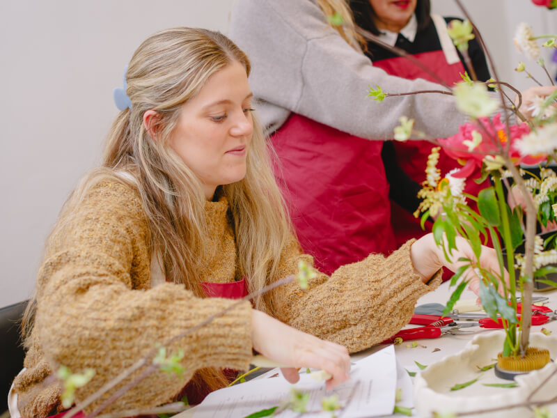 Woman making an Ikebana flower arrangement